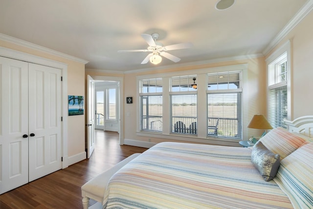 bedroom with multiple windows, dark wood-type flooring, and ornamental molding