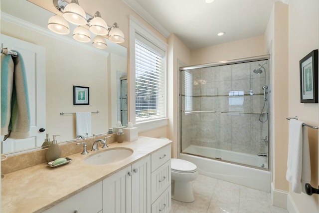 bathroom with tile patterned floors, toilet, ornamental molding, enclosed tub / shower combo, and vanity