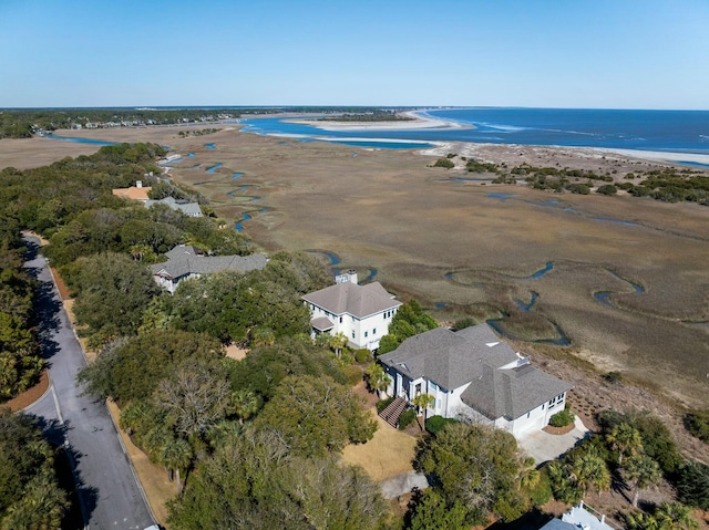 bird's eye view featuring a view of the beach and a water view