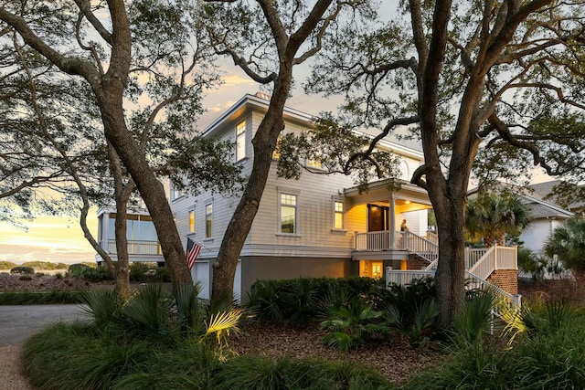 property exterior at dusk with stairs