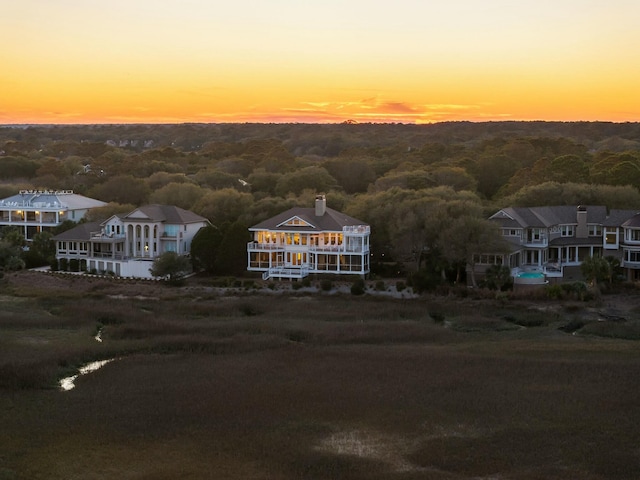 aerial view at dusk with a forest view