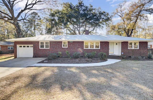 ranch-style home featuring a garage