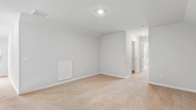 spare room with light colored carpet