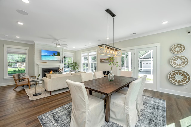 dining room with ceiling fan, dark hardwood / wood-style floors, and crown molding