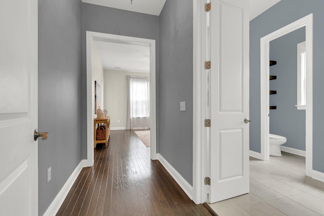 corridor with wood-type flooring