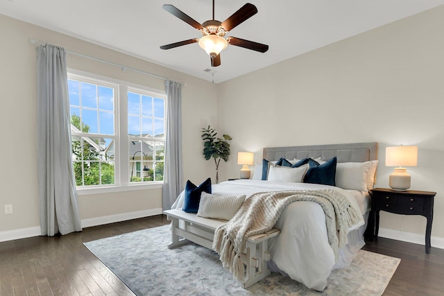 bedroom featuring ceiling fan and dark hardwood / wood-style floors