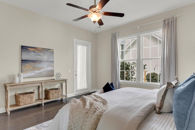 bedroom featuring dark hardwood / wood-style flooring and ceiling fan