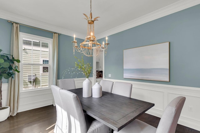 dining room featuring a notable chandelier, dark hardwood / wood-style floors, and ornamental molding