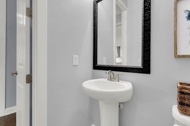 bathroom with toilet and sink