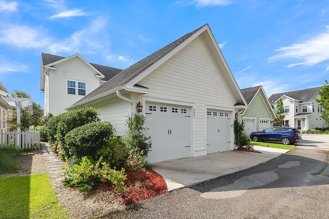 view of side of home with a garage