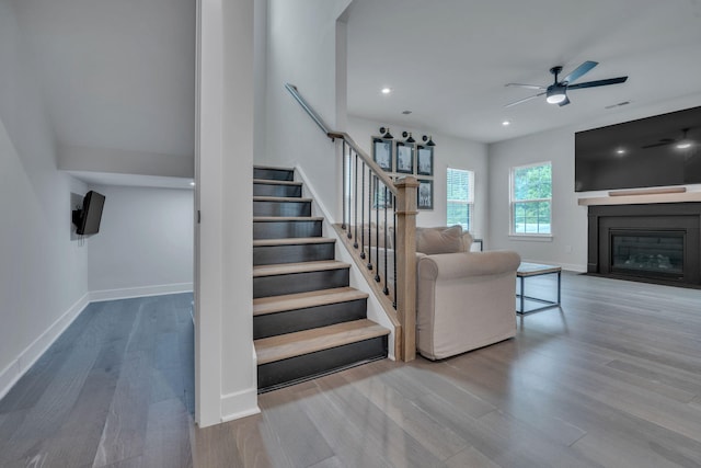 445 Oswego Ct, Greenville, SC 29607 - stairs with wood finished floors, ceiling fan, baseboards, a fireplace with flush hearth, and recessed lighting
