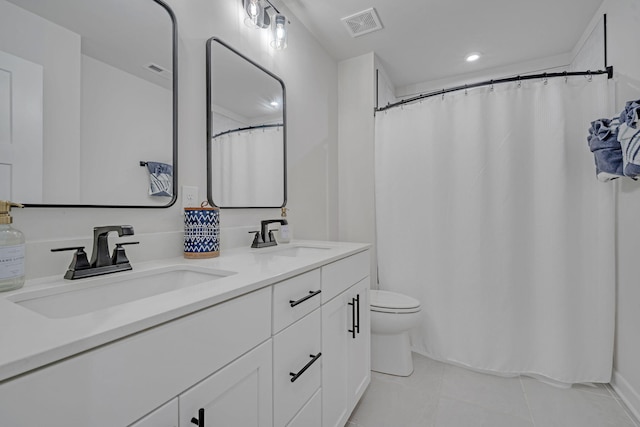 445 Oswego Ct, Greenville, SC 29607 - bathroom featuring tile patterned floors, toilet, double vanity, and recessed lighting