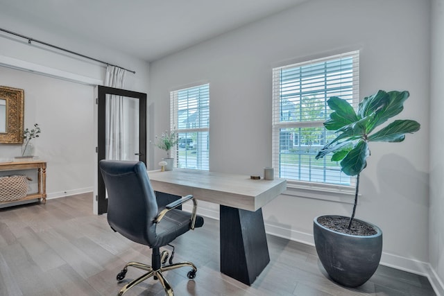 445 Oswego Ct, Greenville, SC 29607 - office with plenty of natural light, wood finished floors, and baseboards