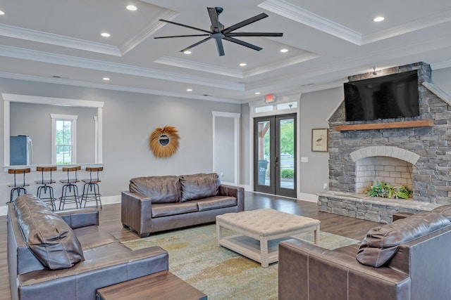 445 Oswego Ct, Greenville, SC 29607 - living room with wood finished floors, ceiling fan, baseboards, a fireplace, and french doors