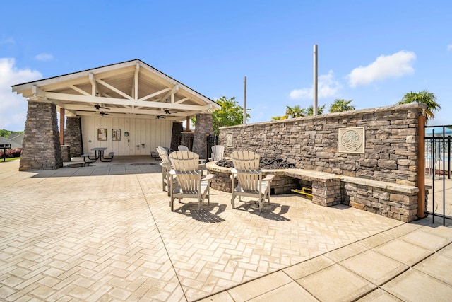 445 Oswego Ct, Greenville, SC 29607 - view of patio / terrace featuring a ceiling fan, a fire pit, and fence