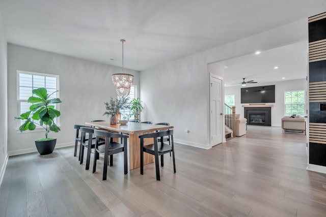 445 Oswego Ct, Greenville, SC 29607 - dining area featuring a glass covered fireplace, baseboards, recessed lighting, wood finished floors, and ceiling fan