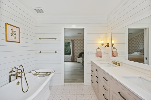 1075 Wayfarer Ln, Charleston, SC 29412 - ensuite bathroom with double vanity, a freestanding bath, wooden walls, and crown molding