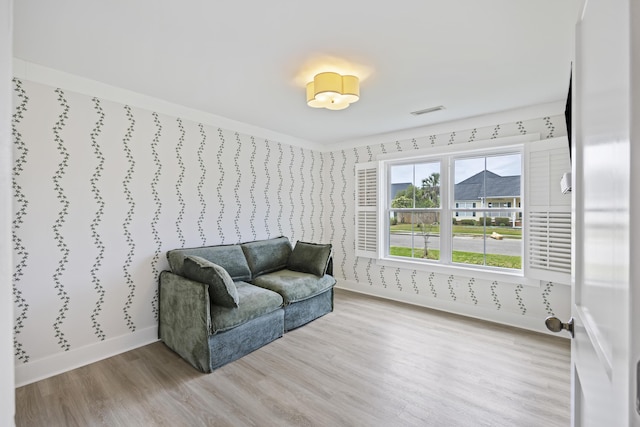 1075 Wayfarer Ln, Charleston, SC 29412 - living area with wood finished floors and wallpapered walls