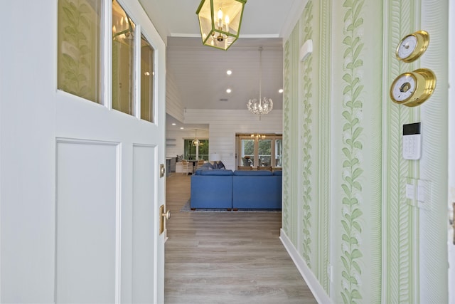 1075 Wayfarer Ln, Charleston, SC 29412 - hall with a chandelier, wood finished floors, and crown molding