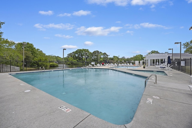 1075 Wayfarer Ln, Charleston, SC 29412 - community pool featuring a patio area