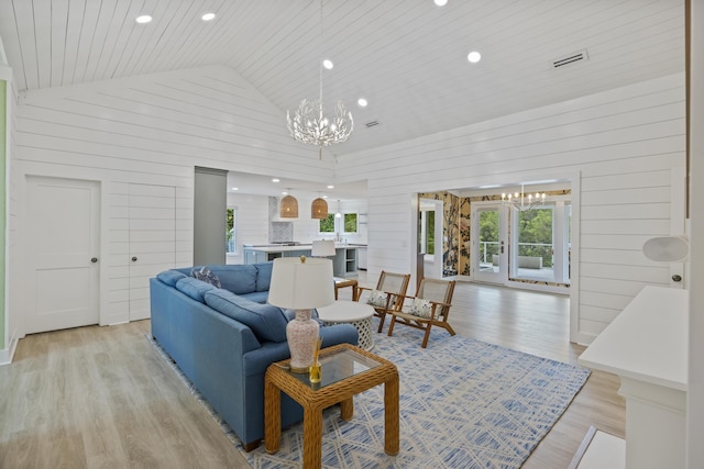 1075 Wayfarer Ln, Charleston, SC 29412 - living room with a chandelier, wood ceiling, light wood-style flooring, wood walls, and recessed lighting