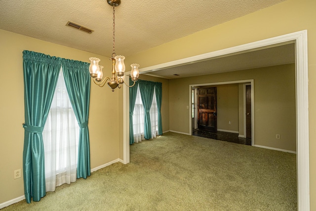 4328 Cheviot Dr, North Charleston, SC 29418 - spare room with healthy amount of natural light, a chandelier, carpet floors, baseboards, and a textured ceiling