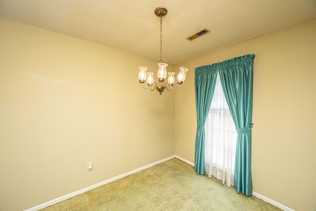 4328 Cheviot Dr, North Charleston, SC 29418 - empty room featuring a chandelier, light colored carpet, baseboards, and a textured ceiling