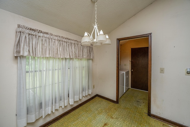 4328 Cheviot Dr, North Charleston, SC 29418 - unfurnished dining area with washing machine and dryer, tile patterned floors, a chandelier, vaulted ceiling, and baseboards