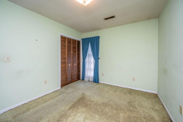 4328 Cheviot Dr, North Charleston, SC 29418 - unfurnished bedroom featuring carpet, a textured ceiling, a closet, and baseboards