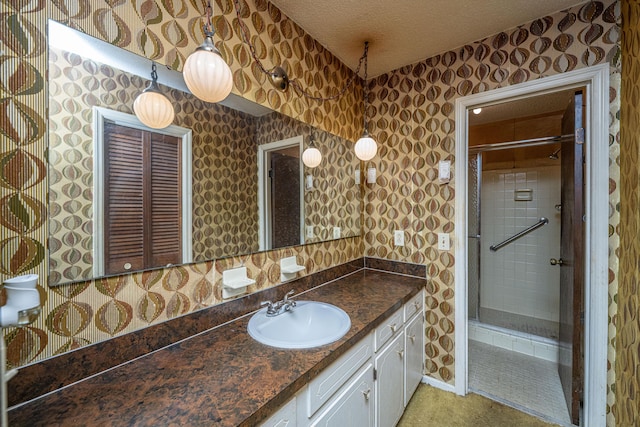 4328 Cheviot Dr, North Charleston, SC 29418 - bathroom featuring a shower stall, a textured ceiling, and vanity