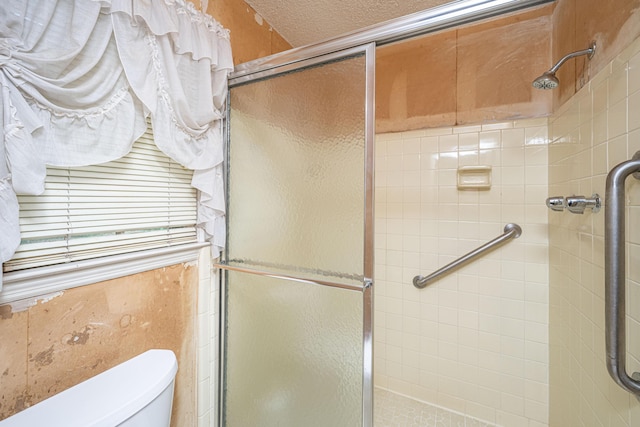 4328 Cheviot Dr, North Charleston, SC 29418 - full bathroom with a stall shower, toilet, and a textured ceiling