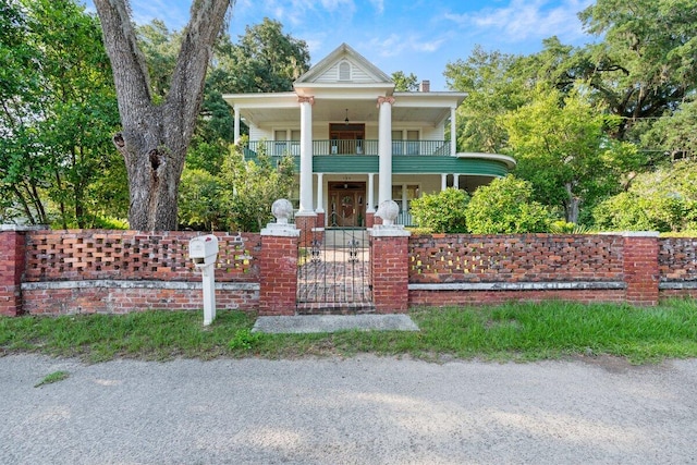 greek revival house featuring a balcony