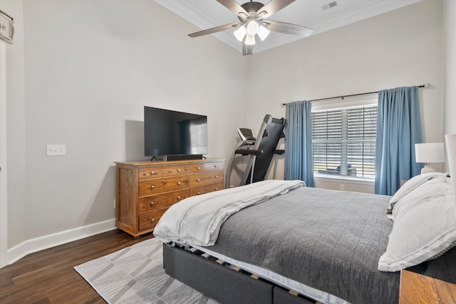 bedroom with visible vents, a ceiling fan, wood finished floors, crown molding, and baseboards