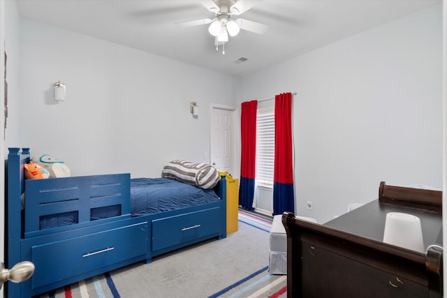 bedroom featuring a ceiling fan and visible vents