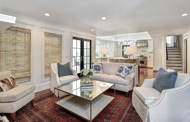 living area with stairway, a notable chandelier, recessed lighting, and dark wood-style flooring