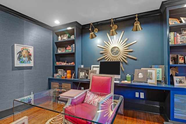 home office with an accent wall and wood finished floors