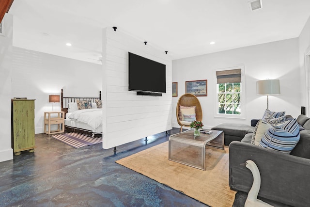 living room featuring recessed lighting, visible vents, and finished concrete floors