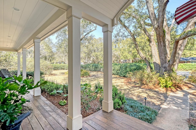 wooden terrace with a porch