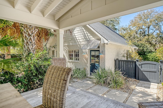 view of patio / terrace with fence and a gate