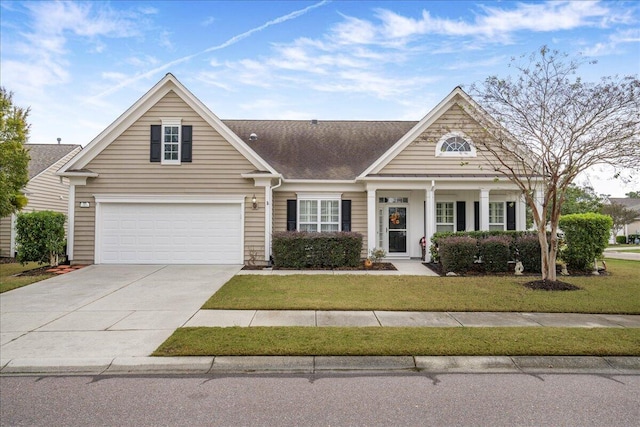 view of front facade with a front yard and a garage