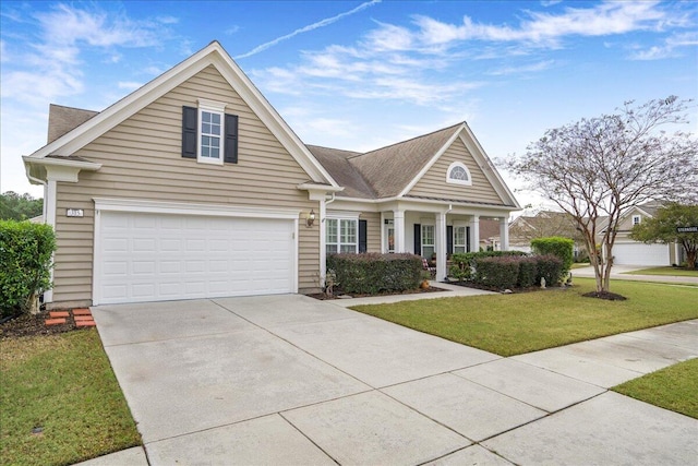 view of front of home featuring a front yard and a garage