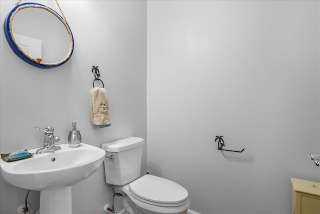 bathroom featuring sink and toilet