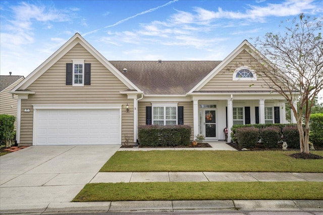 view of front facade featuring a front yard and a garage