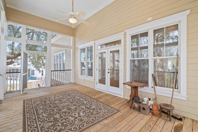 sunroom / solarium featuring french doors and ceiling fan