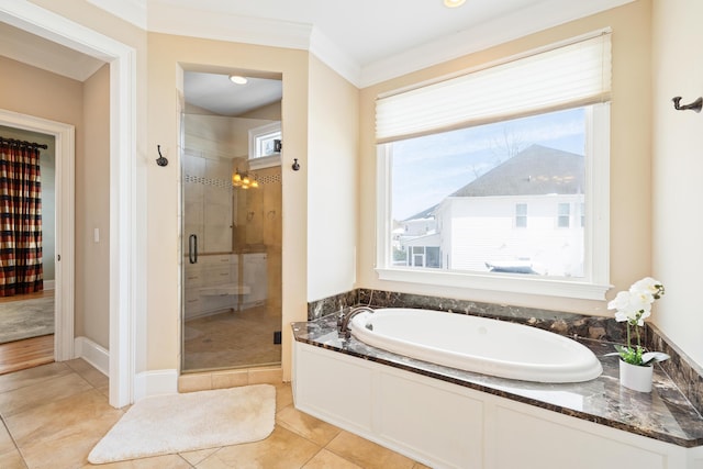 bathroom with tile patterned floors, ornamental molding, and plus walk in shower