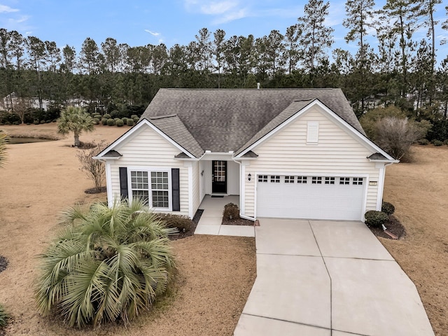 view of front of home featuring a garage and a front lawn