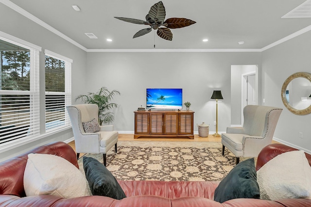 living room featuring ceiling fan and crown molding