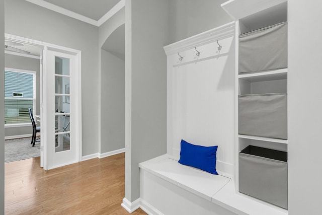 mudroom featuring hardwood / wood-style floors and crown molding