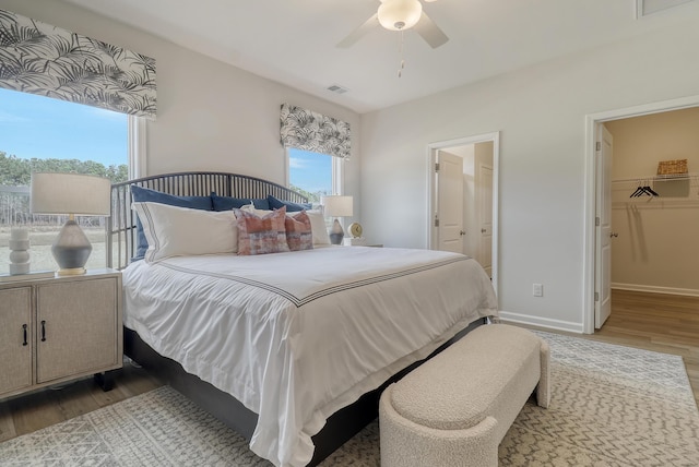 TBD Oleary Cir, Summerville, SC 29483 - bedroom with visible vents, baseboards, wood finished floors, a ceiling fan, and a spacious closet
