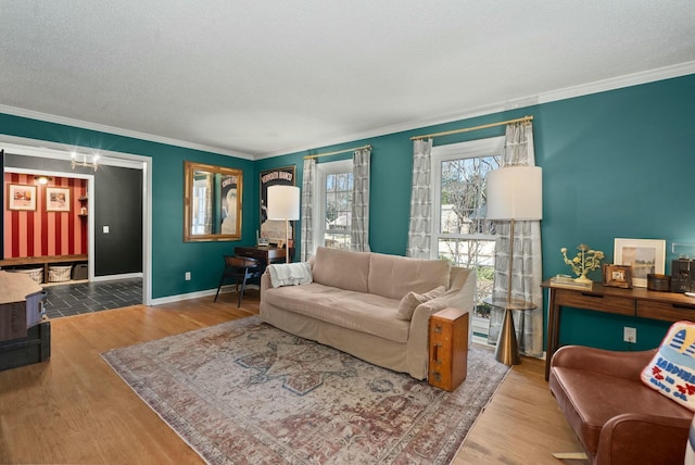 living room with baseboards, wood finished floors, and ornamental molding